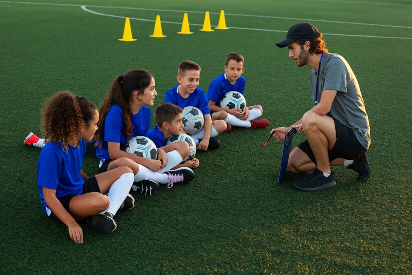 football-trainer-teaching-children-side-view_23-2149742033